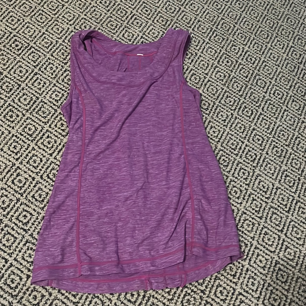 Running tank top with ruffles in the back.